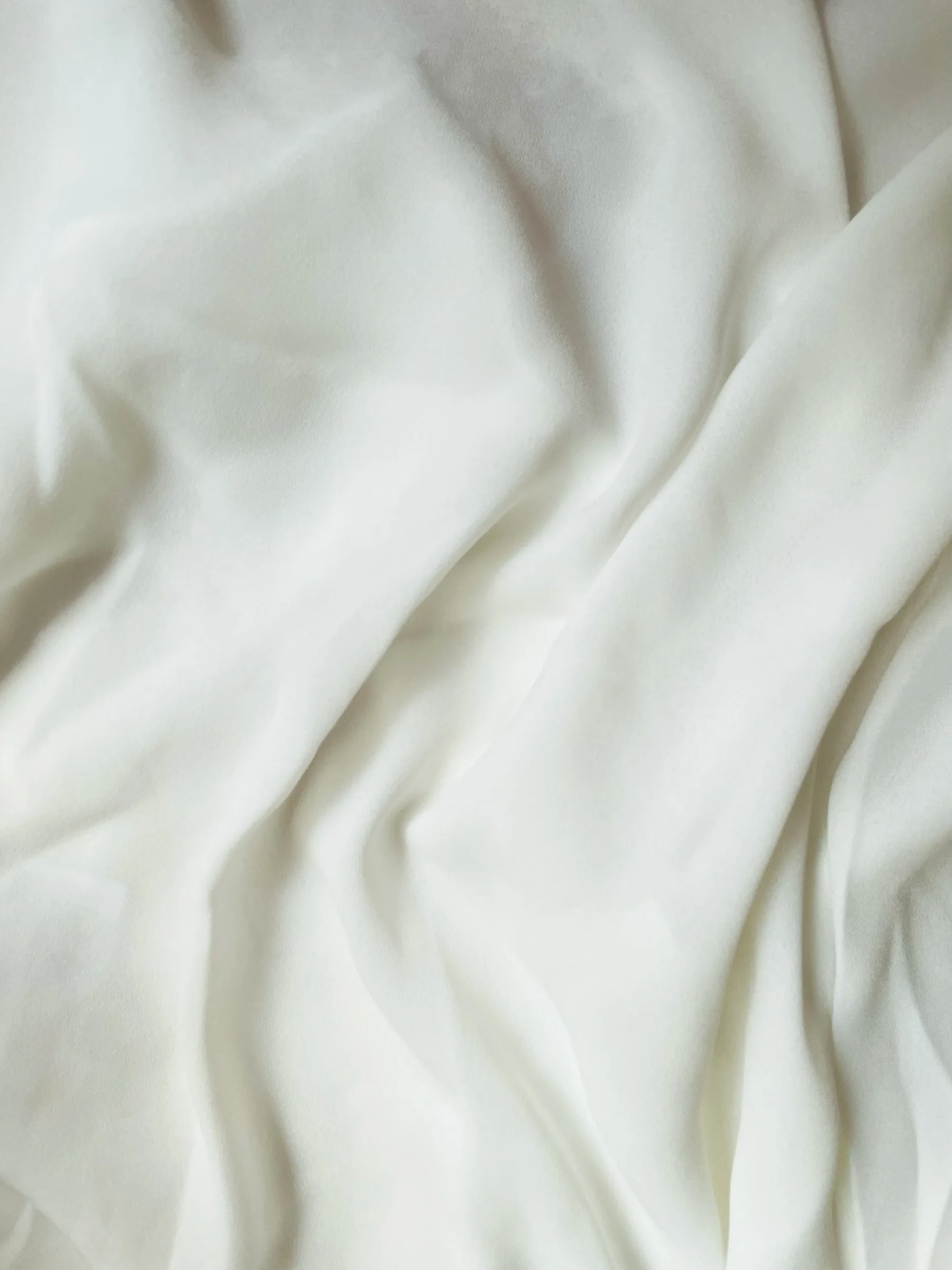 Close-up of soft white linen folds